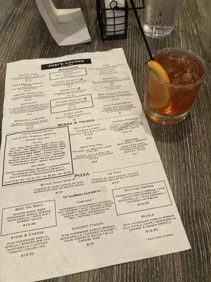 Christmas old fashioned (specialty holiday cocktail) and one side of the menu