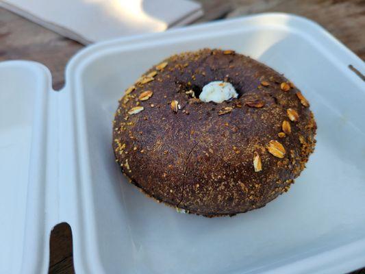 Pumpernickel bagel with jalapeño cream cheese