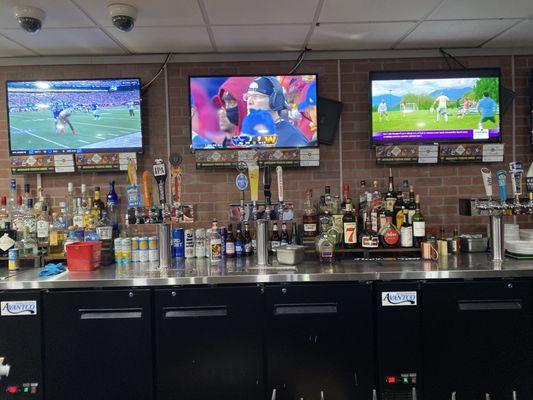 3 of 6 TVs at the bar and 12 of 20 taps