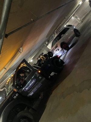 The vehicle being towed out of a parking garage.