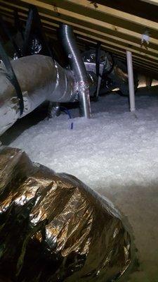 We blew in 14 inches of Knauf Jet Stream fiberglass insulation.