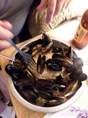 Mussels on a bed of linguini.