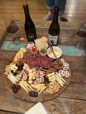 Large charcuterie board and the wines that we love.