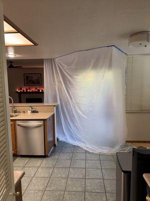 Tented off area to work inside so no dust gets into our house.