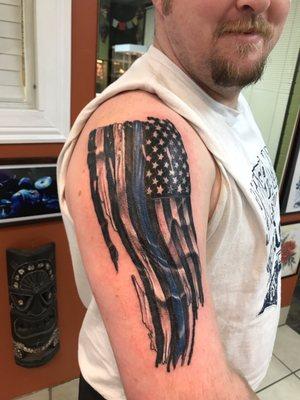 Blue line flag tattoo by casey wardell