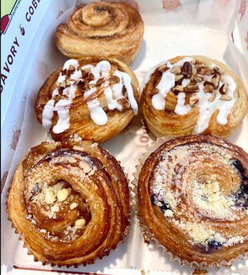 Back: Original Cinnamon Roll; Middle: Pecanilla Crunch; Front: Peach Cobbler and Blueberry Cobbler