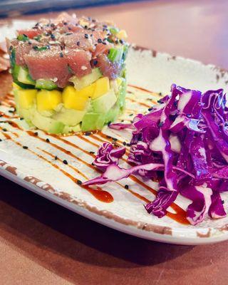 Ahi Tartare - avocado, cucumber, mango, topped with black sesame seed.