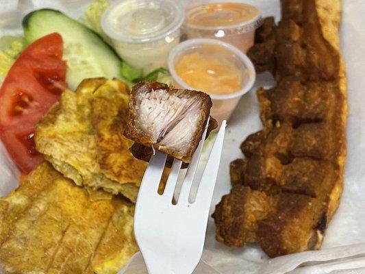 Chicharron - fried pork belly, crispy and delicious - after a bite