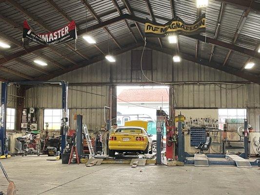 Techs installing the OEM cat-back on my  ultra rare "Chrome Yellow" Mustang GT.