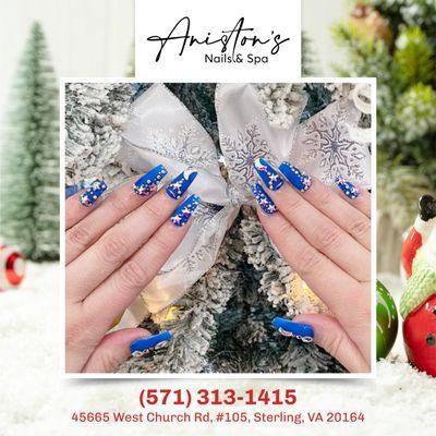 Make a statement this Christmas with glamorous blue nails embellished with radiant rhinestones, adding a touch of festive sparkle to your ho