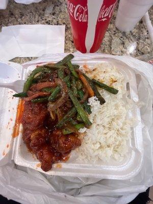 Orange chicken, spicy beef, and white rice. It is really good and I'd recommend to try. It's worth it's value.