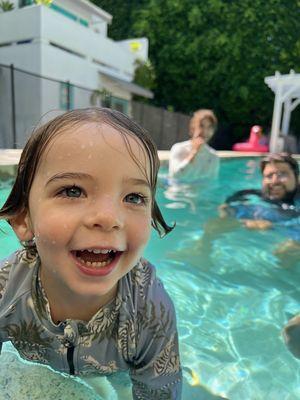 Young student showing how much he loves the water