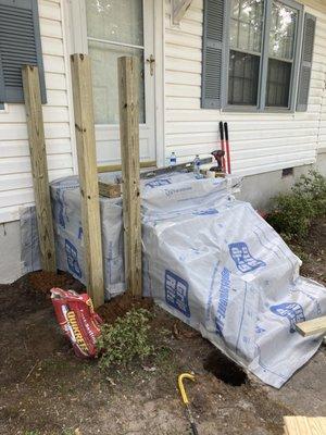 Installing handrails in main entrance.