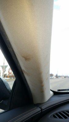 A Pillar Trim Panel Shows Hand Print stains after service at Champion Chevrolet of Howell, Michigan