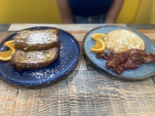 Brûlée French toast with over medium eggs and bacon