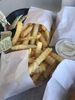 The crinkle cut fries with seasoning.