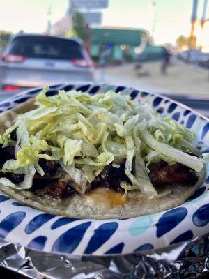 Soft Taco (Street Taco) with carne asada. Modified with just lettuce and cheese