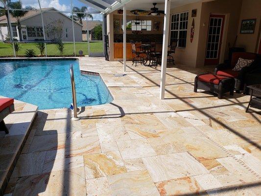 New travertine decking. Looks great and low up keep.