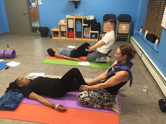 Co-founder, Cassie Fireman, doing thai body work at her free thai massage workshop at Harlem Dream Center