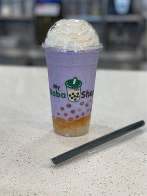 Taro ice blend with whipped cream, mango popping boba, and lychee jelly