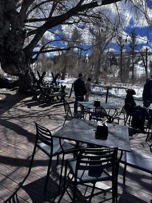 Outdoor patio by the river open in April