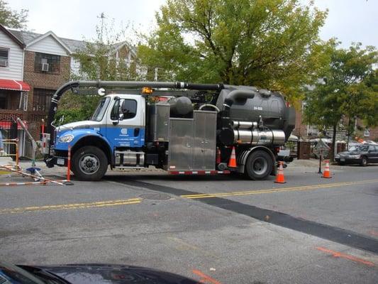 ConEdison Flush Truck to clean out manhole