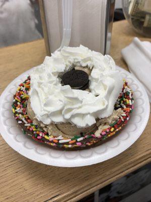 My brother's coffee Oreo ice cream in waffle bowl with sprinklers and whipped cream