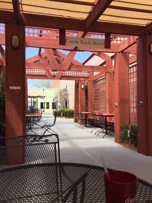 On their cute patio. This is the perfect day for alfresco dining.