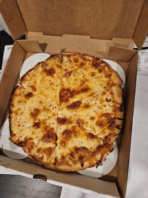 Small cheese pizza in it's delivery box