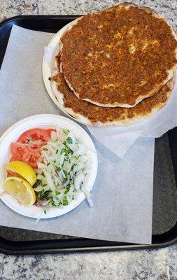 Lamachan Ancient Turkish Pie (3 pieces). Super thin crust with minced lamb, beef and spices. Add lemon, tomato, chopped onion & enjoy.