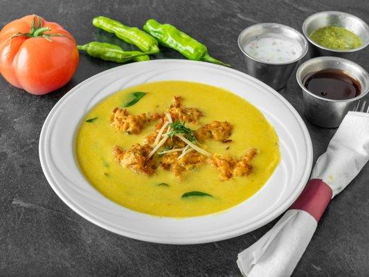 Kadhi- a traditonal North Indian Dish, vegetarian prepared with Chick Pea Flour, Yogurt and Chick Pea Fritters