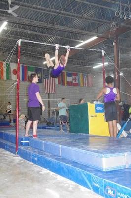 Boys team members on High Bar