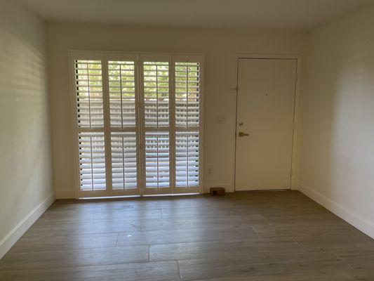 Shutters over sliding glass door