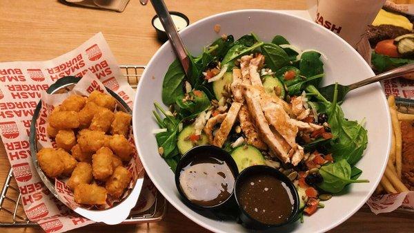 Spinach, cucumber, and goat cheese salad with grilled chicken