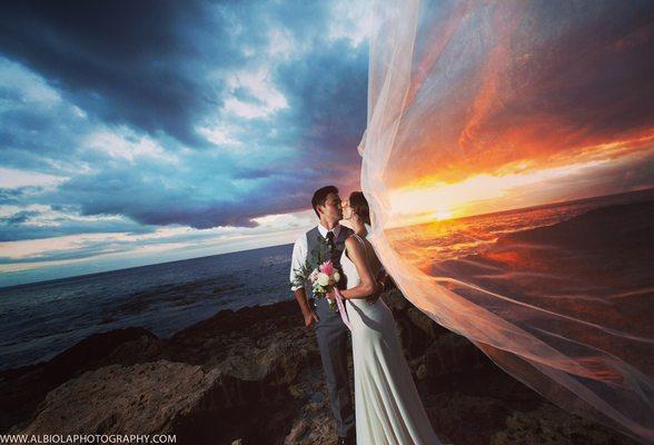 What a magical moment to capture this for our couple at Paradise Cove. The wind picked up her veil with the sunset on the background.