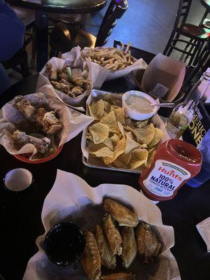 Wings fries and queso and chips