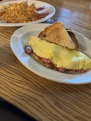 Ham & Cheese Omelet with a side of hash browns.