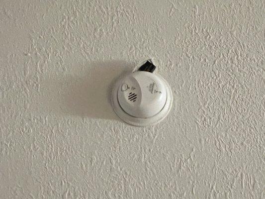 Smoke detector with battery popped out