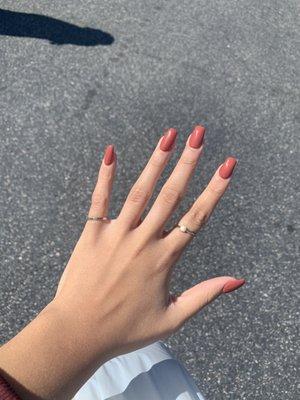 Reddish brown nails.