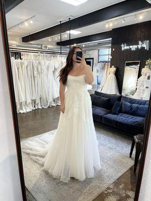 Wedding dress store, view of dress in mirror