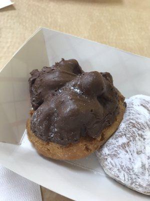 Chocolate covered buttermilk and raspberry filled donut