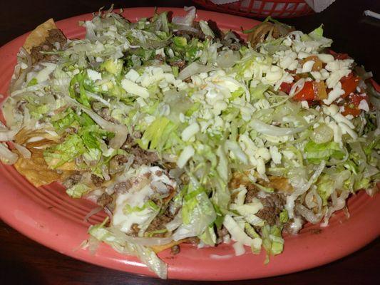 Supreme Nachos (beef) is a most delicious sharing appetizer.