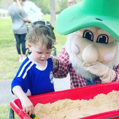 A child plays with an interactive sensory bin at the Partnership's booth during PirateFest.