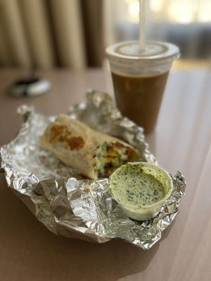 Breakfast burrito ( tots and egg) and iced vanilla latte.