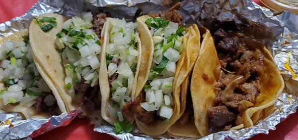 3 asad tacos on left with 3 pastor one with no onion and cilantro