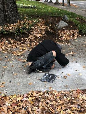 No shortage of addicts near by. This man was sleeping beside my car which had just been broken into.