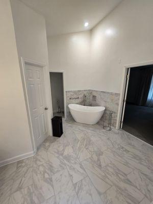 Bathroom remodel, view of luxury deep tub, floor and recess lighting.