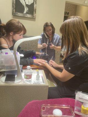 Making the almond shape, lady talking on the phone while she does my daughter's nails