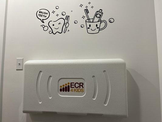 Baby changing table in a gender neutral bathroom is a thoughtful touch