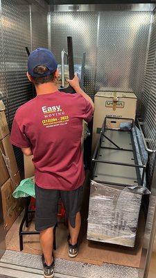 Easy Moving mover in service elevator loaded with cargo.